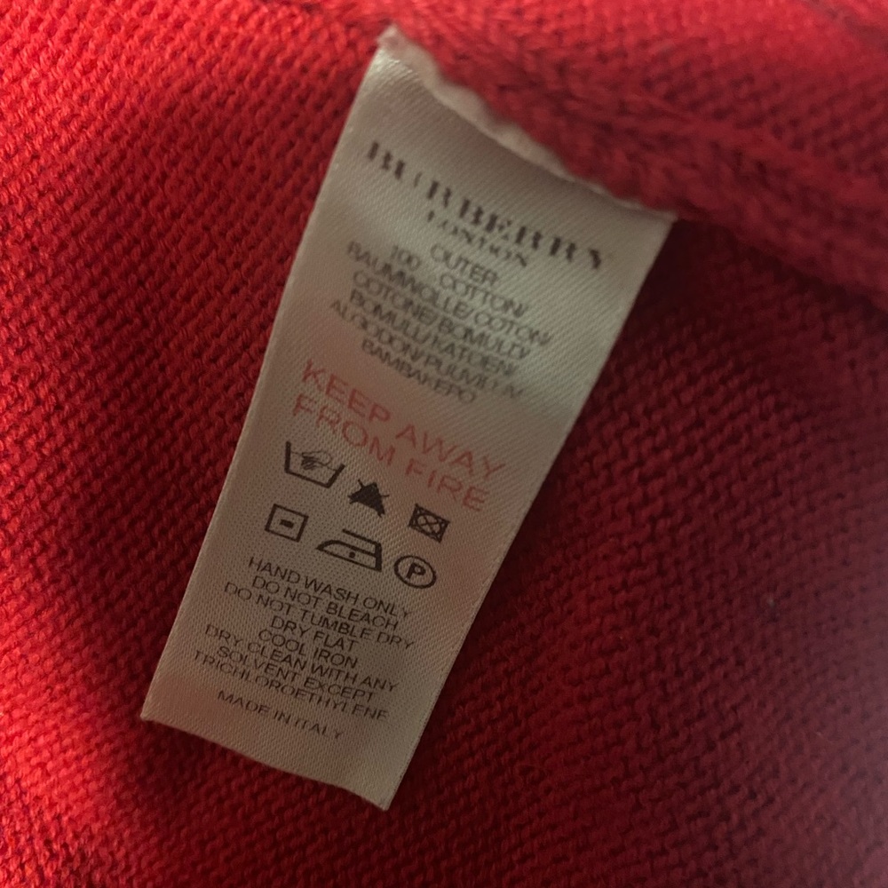 Red Burberry baby girl sweater.